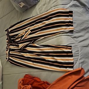 Peach black and white striped dress pants cropped